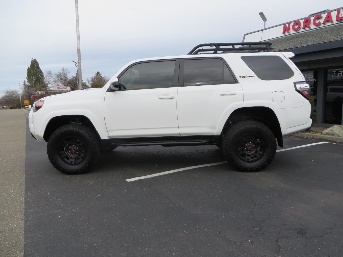 2019 White /BLACK Toyota 4Runner TRD Pro (JTEBU5JR3K5) with an 4.0L V6 engine, 5 -Speed Automatic transmission, located at 2630 Grass Valley Highway, Auburn, CA, 95603, (530) 508-5100, 38.937893, -121.095482 - Features Ironman 4X4 suspension, BFG tires, Rockslider, Roof rack, window tint, and interior Rago Fab Molle storage racks. - Photo#7